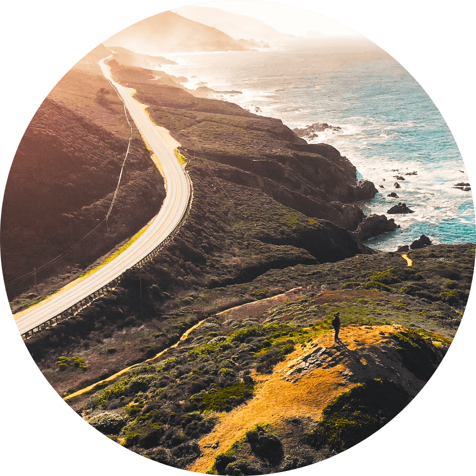 Overhead view of California highway near ocean.